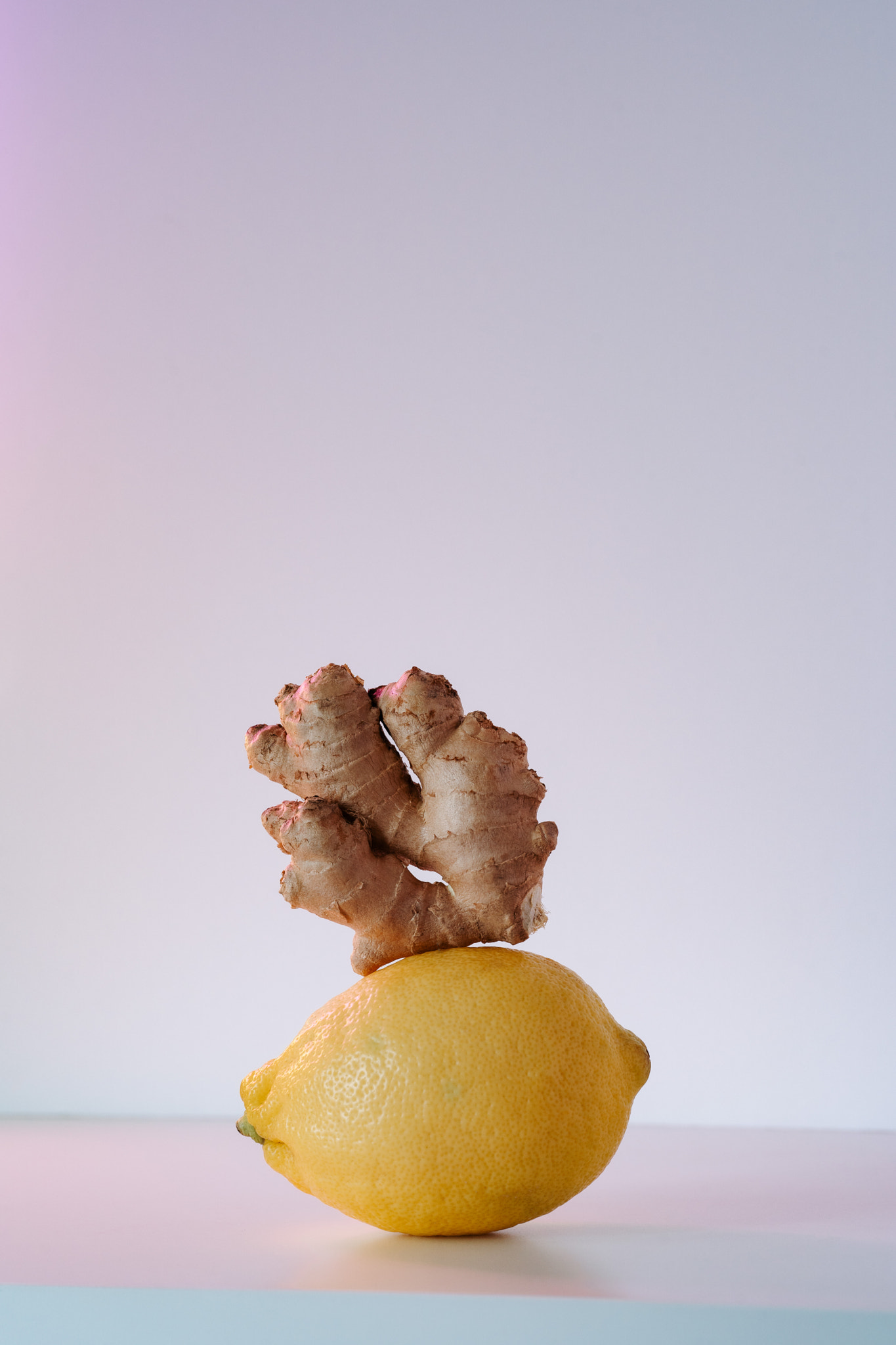 Lemon and ginger root on white background