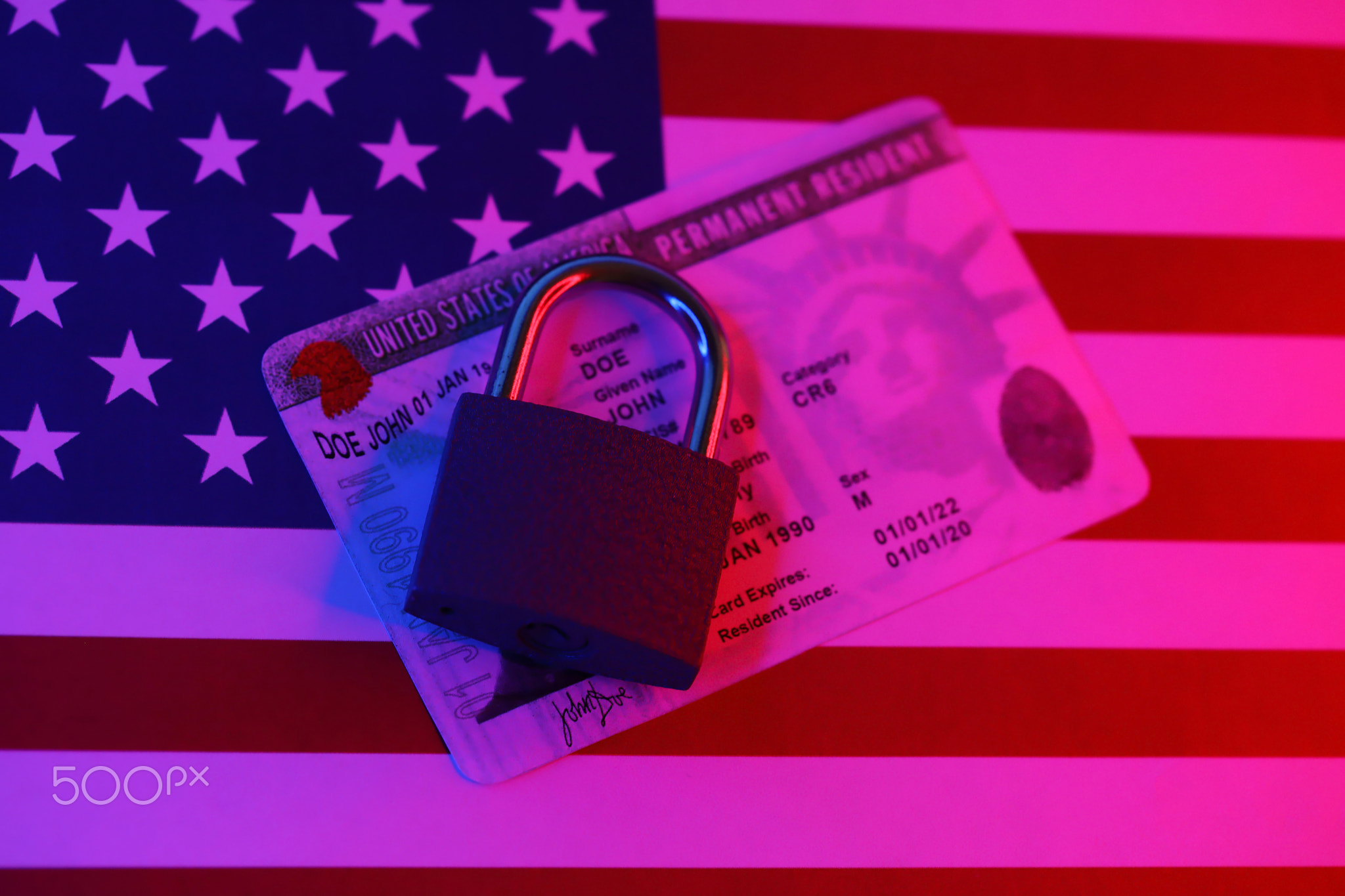 Permanent resident green card for US DV-lottery with small padlock on US flag