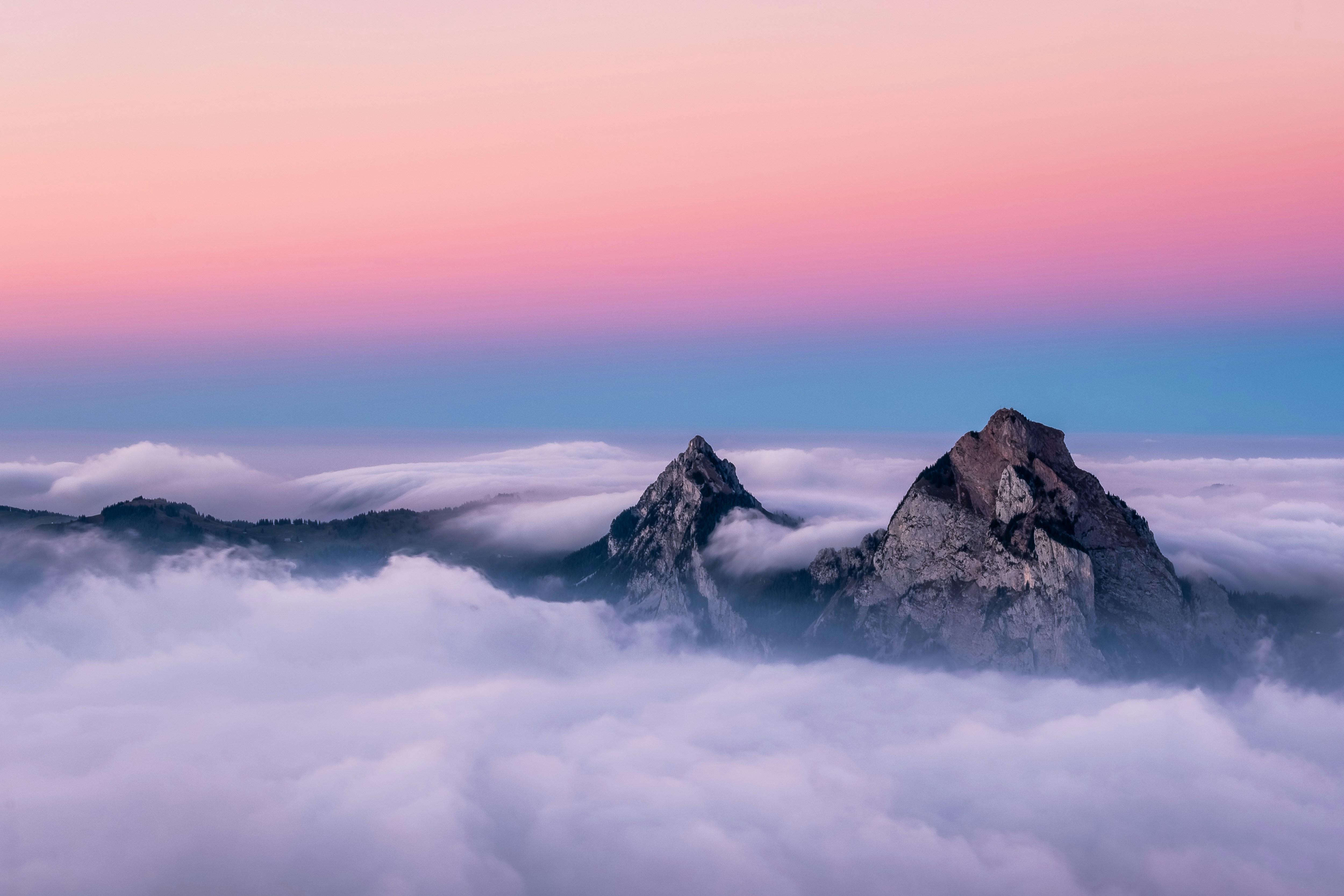 Life is full of adventures. This image was created during one of my own adventures on the top of Fronalpstock in Switzerland. During the day thousands and thousands of tourists  where passing by this spot. But the last chairlift was running at 5:30pm. Suddently the place became very quiet and calm. The fog started to clear up and reveal the two peaks.  This image represents one of the most beautiful sunsets I ever saw.